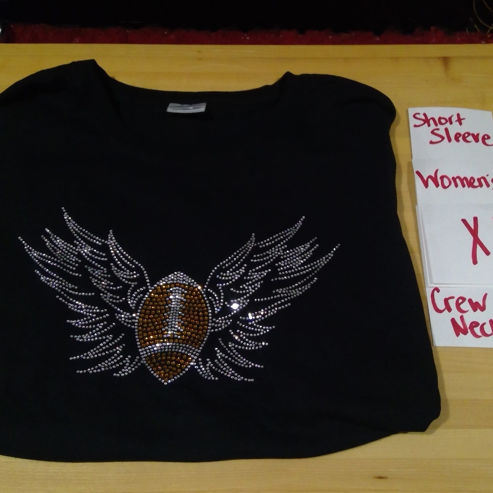 Football with angel wings in bling